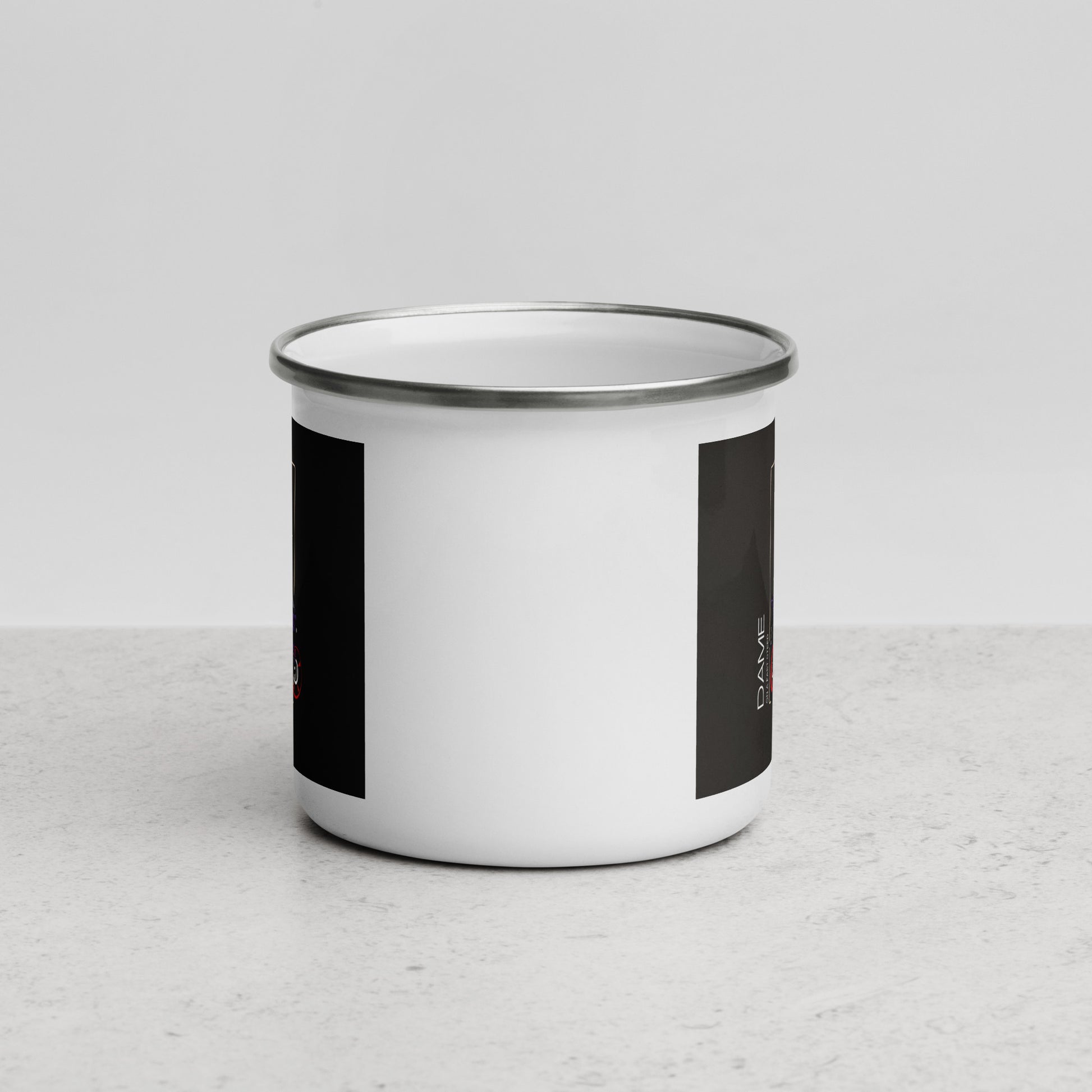 White enamel motorcycle mug gift with metal rim by The Biker Mule on gray surface