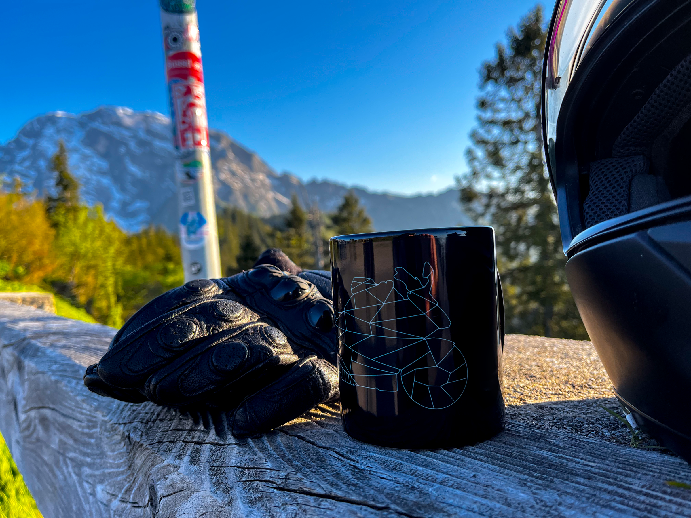 Black mug with motorcycle design on wooden railing next to gloves and helmet GSX-R gift for riders