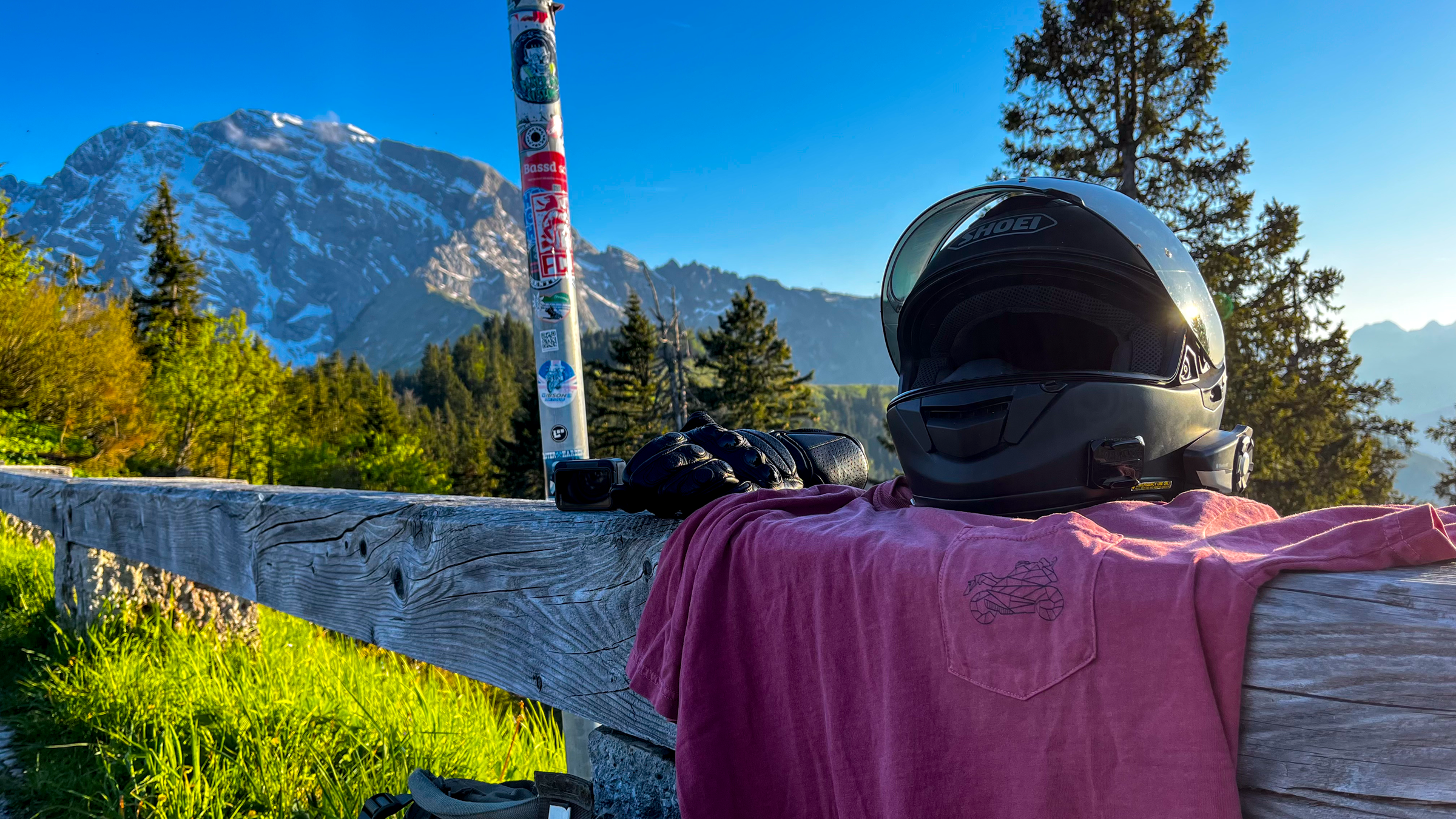 GSX-R pocket shirt for men by The Biker Mule displayed outdoors on wooden fence next to motorcycle helmet