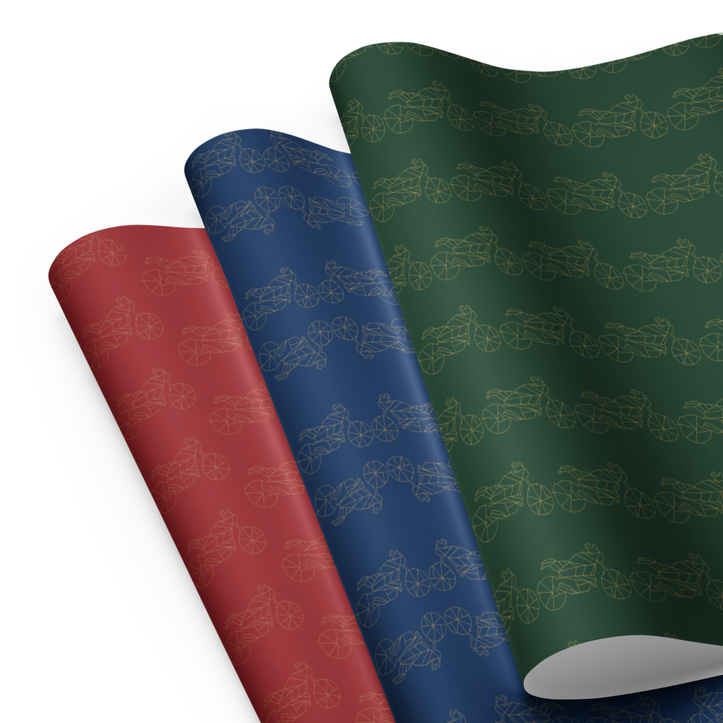 Colorful motorcycle gift wrapping paper featuring blue, red, and green patterns for bikers